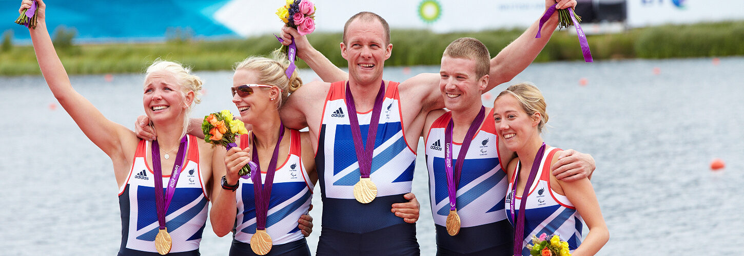 Para-rowing crew with medals