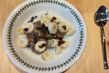 Bowl of Weetabix with banana and sultanas