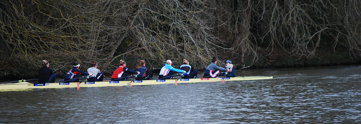 women's eight rowing with good timing