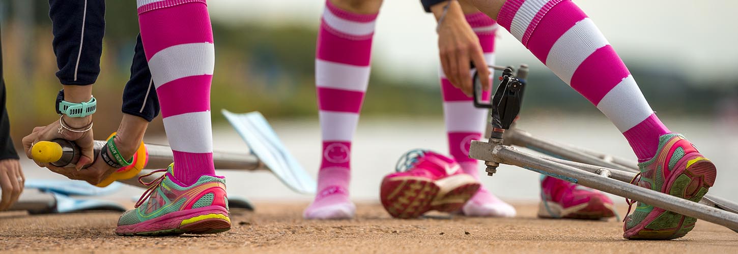 rowers wearing pink and white socks