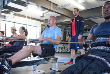 Rowers training indoors