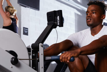 Man at catch on indoor rower