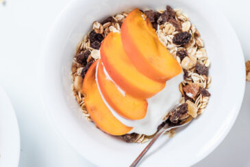 Sliced mango on muesli