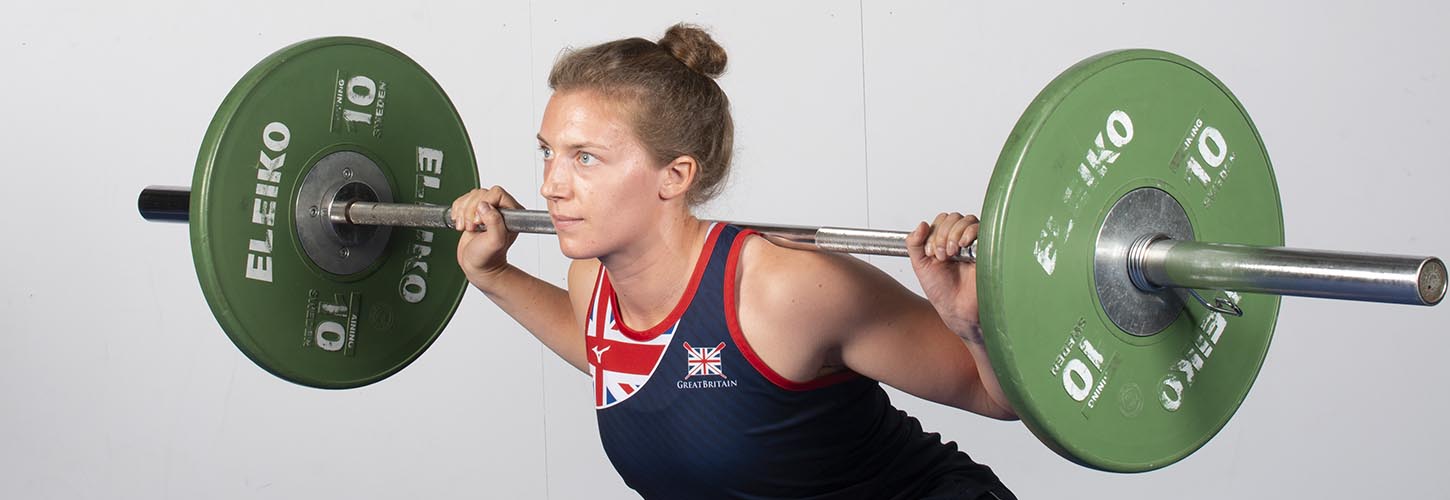 woman doing back squat for strength and power