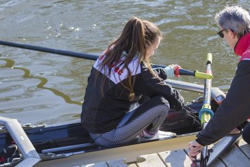 rowers adjusting footplate on landing stage