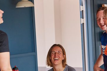 rowers and coach laughing