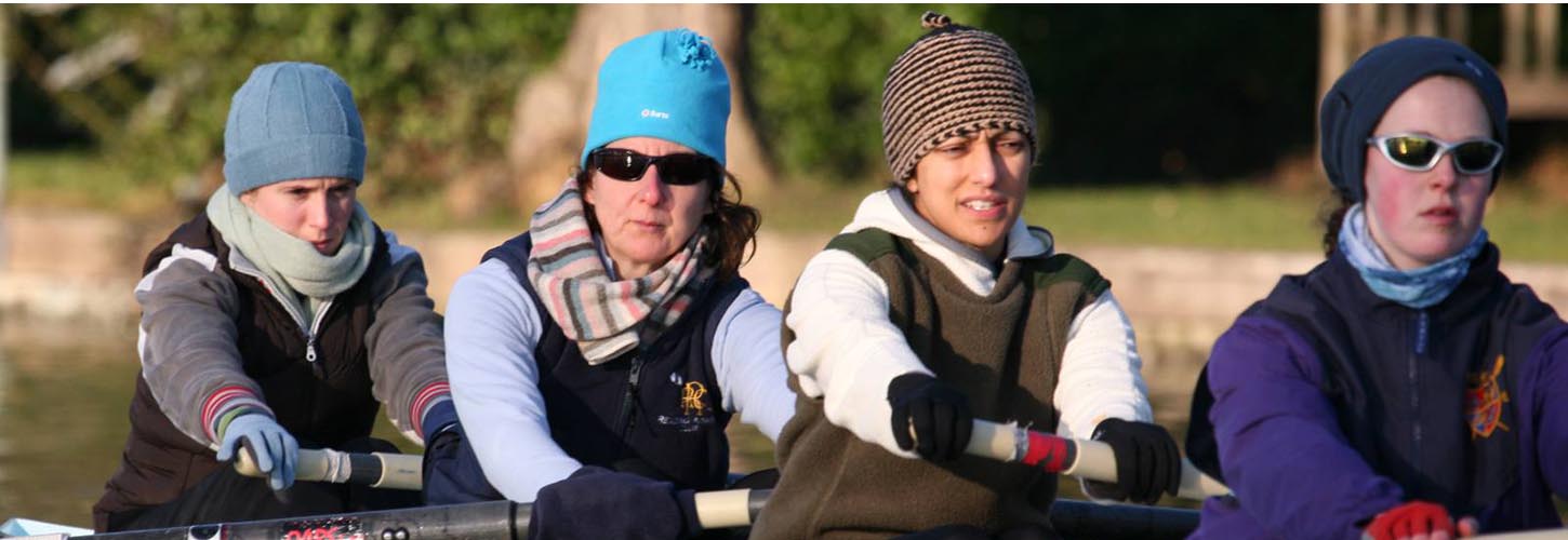 women rowing in beanie hats
