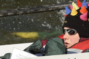Cox in hat with coloured spikes in front loader