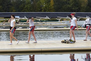 Carrying boat off landing stage