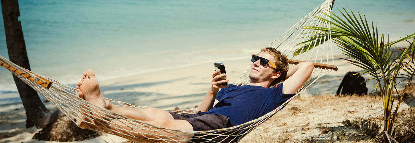 man in hammock on beach