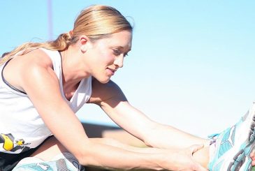 woman stretching her hamstrings