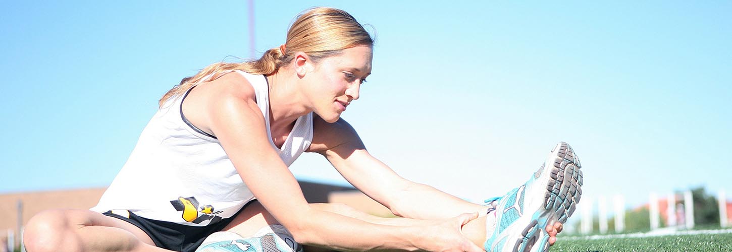 woman stretching her hamstrings