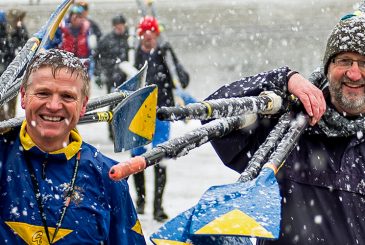 rowers carrying blades in snow