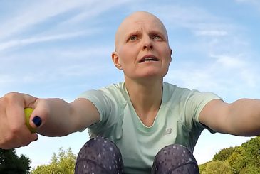 woman rowing during chemo with bald head