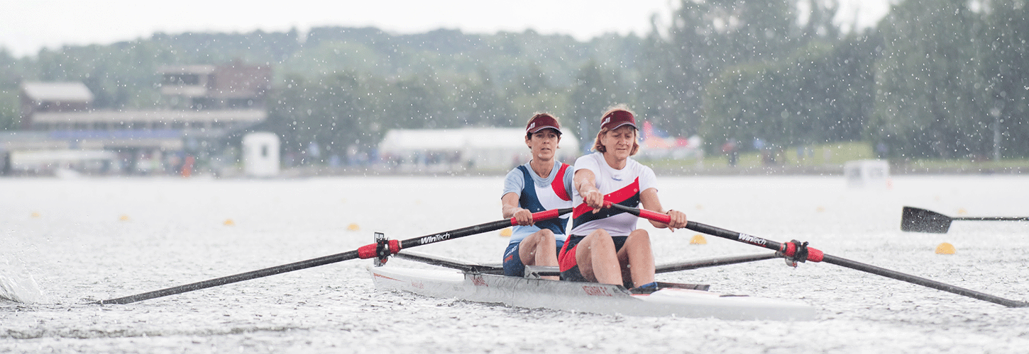 women's pair racing in heavy rain