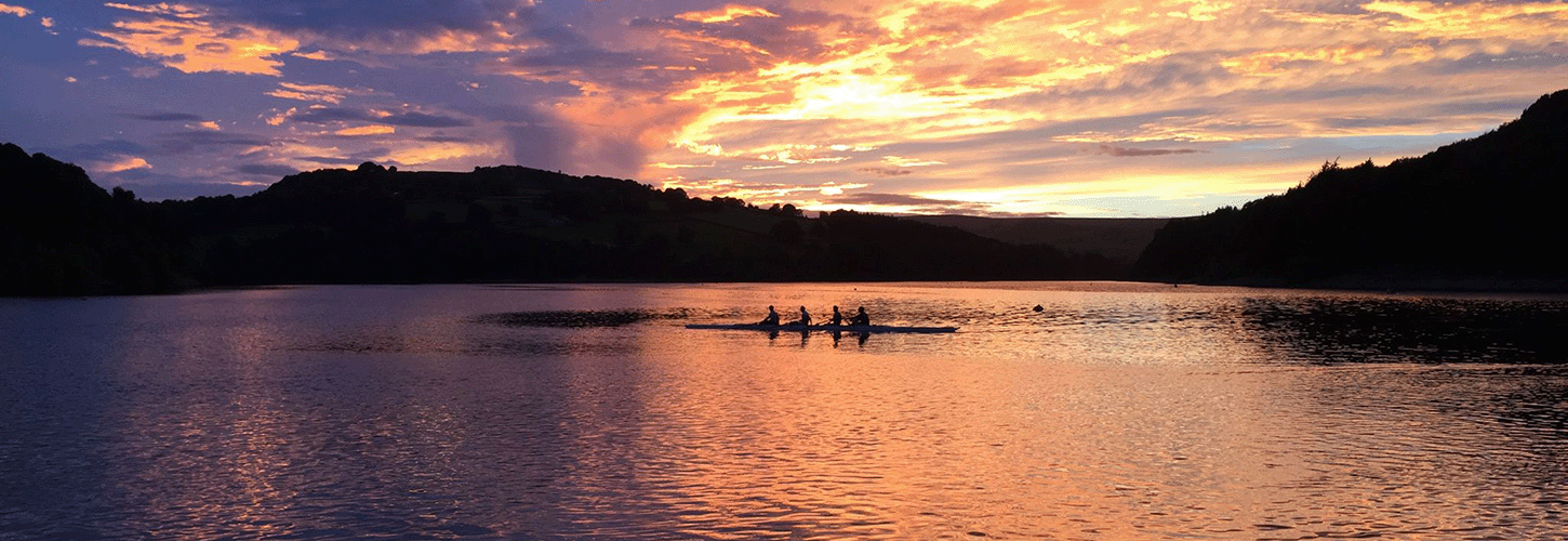 A crew cooling down on the water in sunset