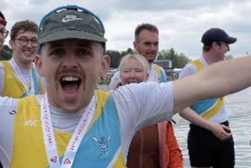 Male student rower celebrating