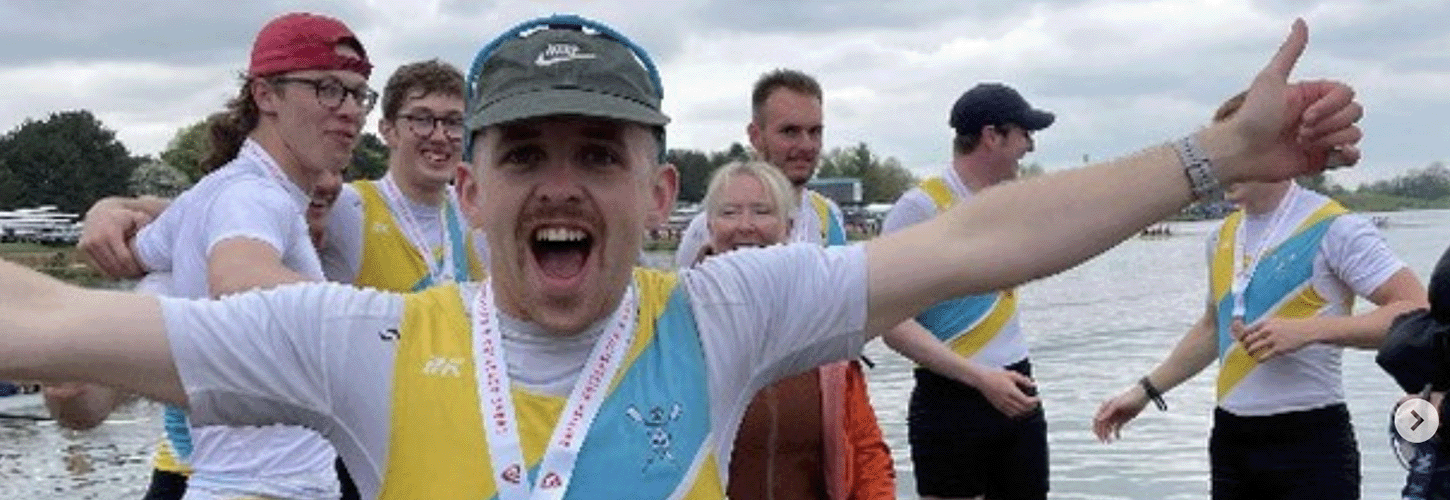Male student rower celebrating