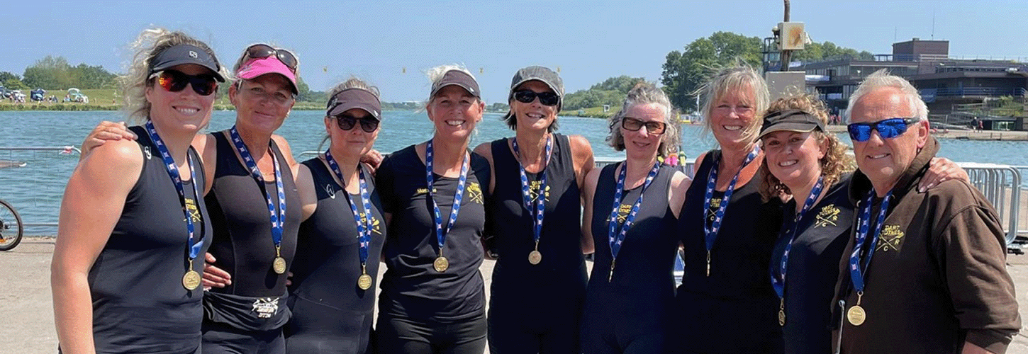 Masters women wearing medals - with coach