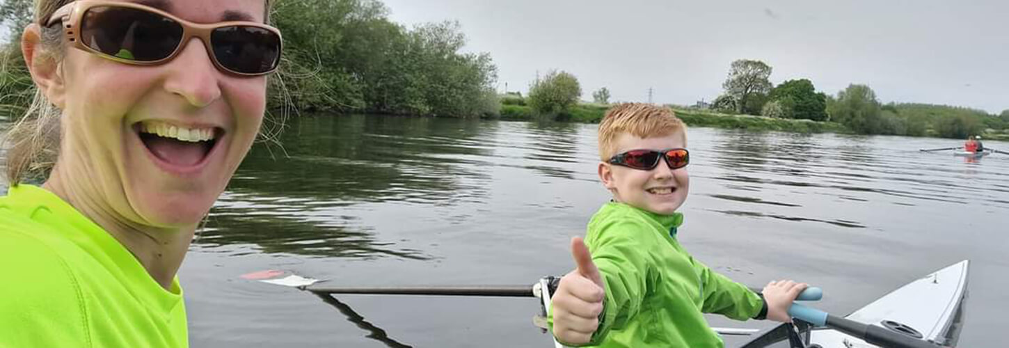 Mum and son rowing