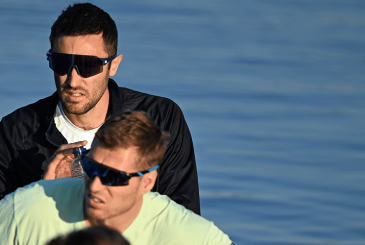 Man focusing at bow of an eight