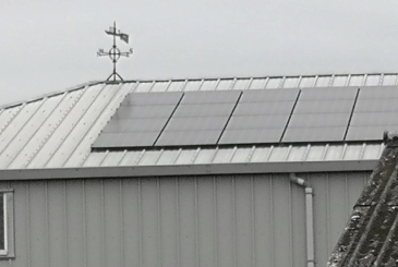 boathouse roof with PV panels and Walton RC logo