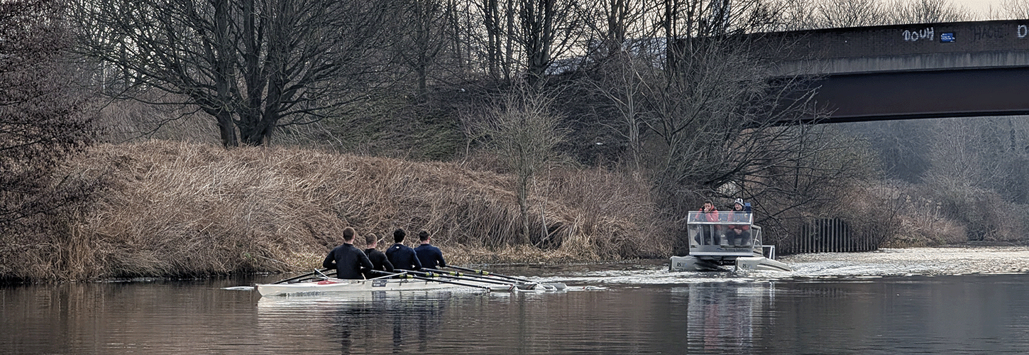 quad with coach on water in winter