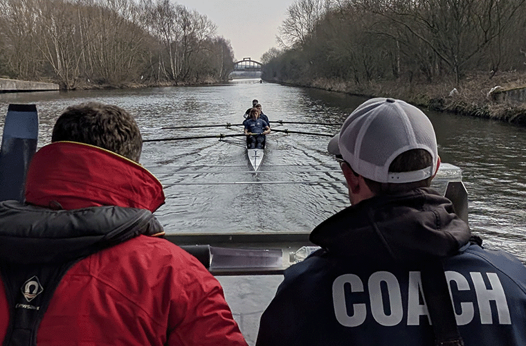 Coaches monitoring crew on water