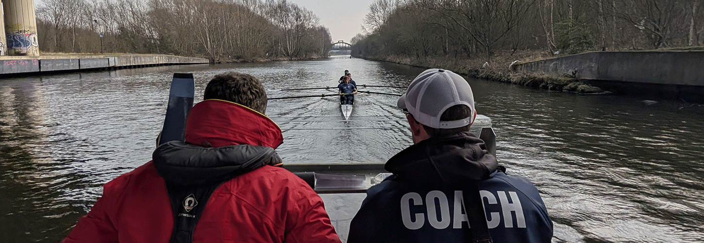Coaches monitoring crew on water